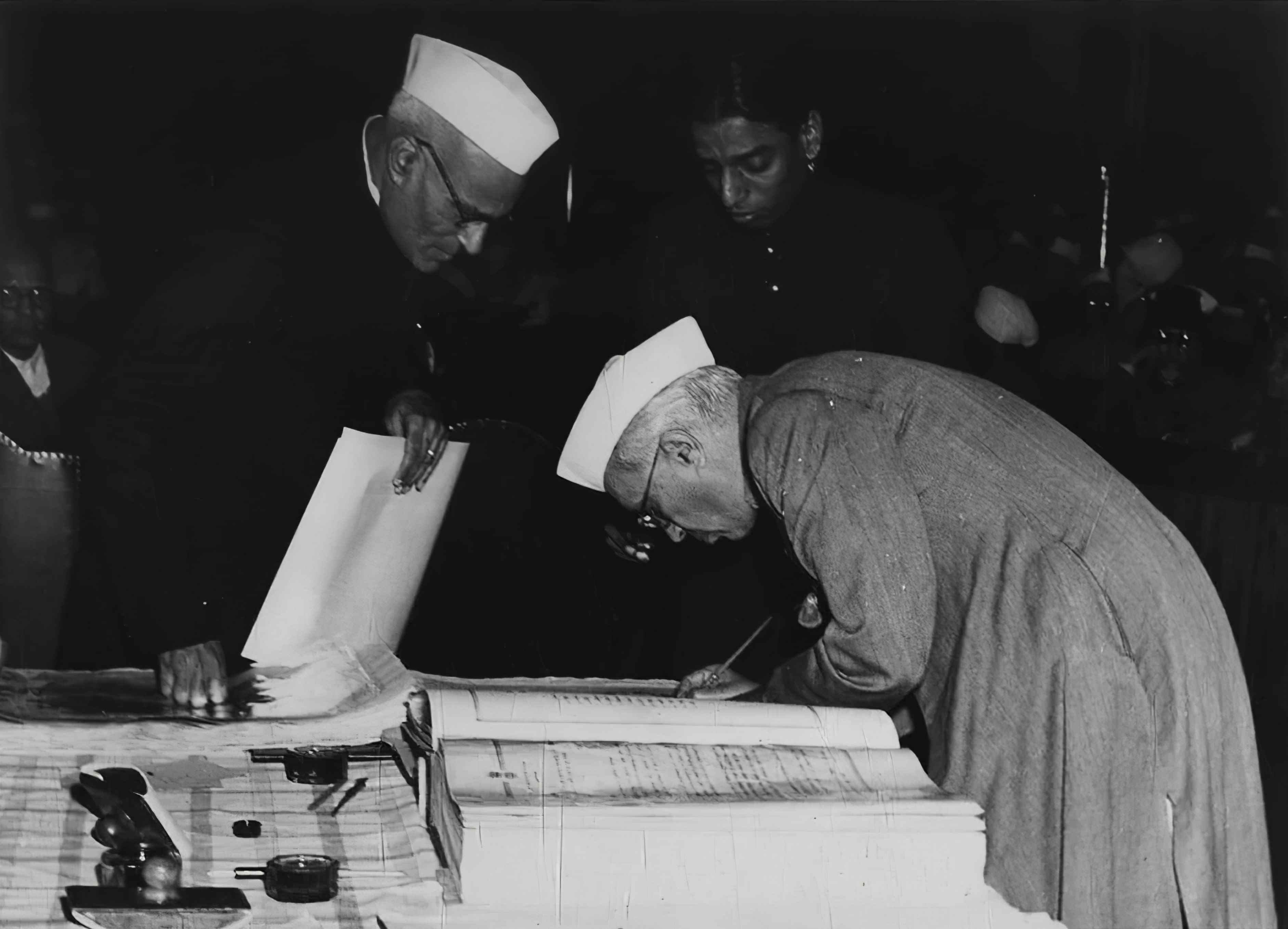 Jawaharlal Nehru signing Indian Constitution